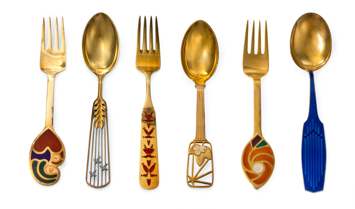 Fourteen Danish Silver-Gilt and Enamel Christmas Spoons and Forks, Anton Michelsen, Copenhagen, comprising spoon and fork examples for