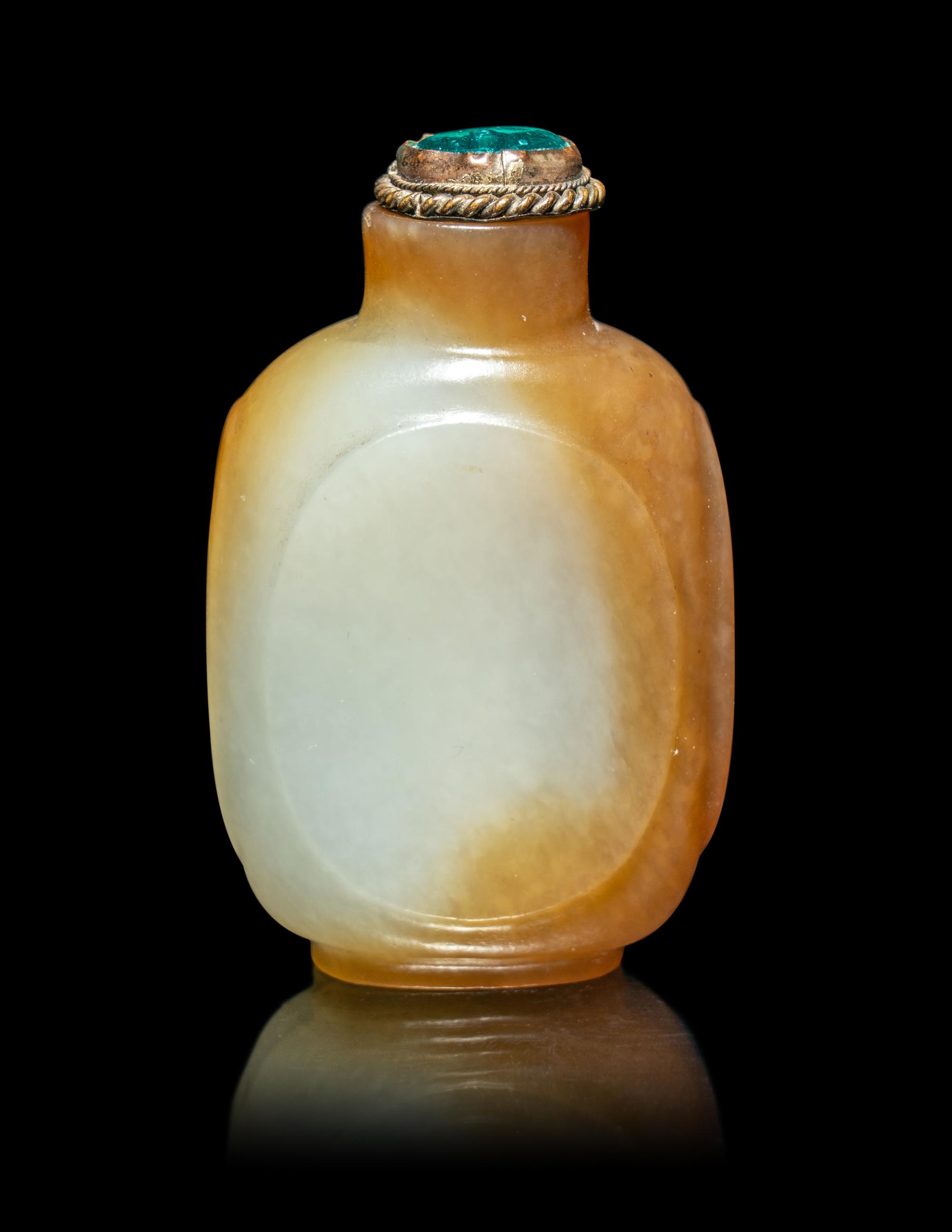 A Chinese Russet and Pale Celadon Jade Snuff Bottle