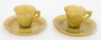 A Pair of Chinese Yellow Jade Cups and Saucers Diameter of saucer 4 3/4 inches.