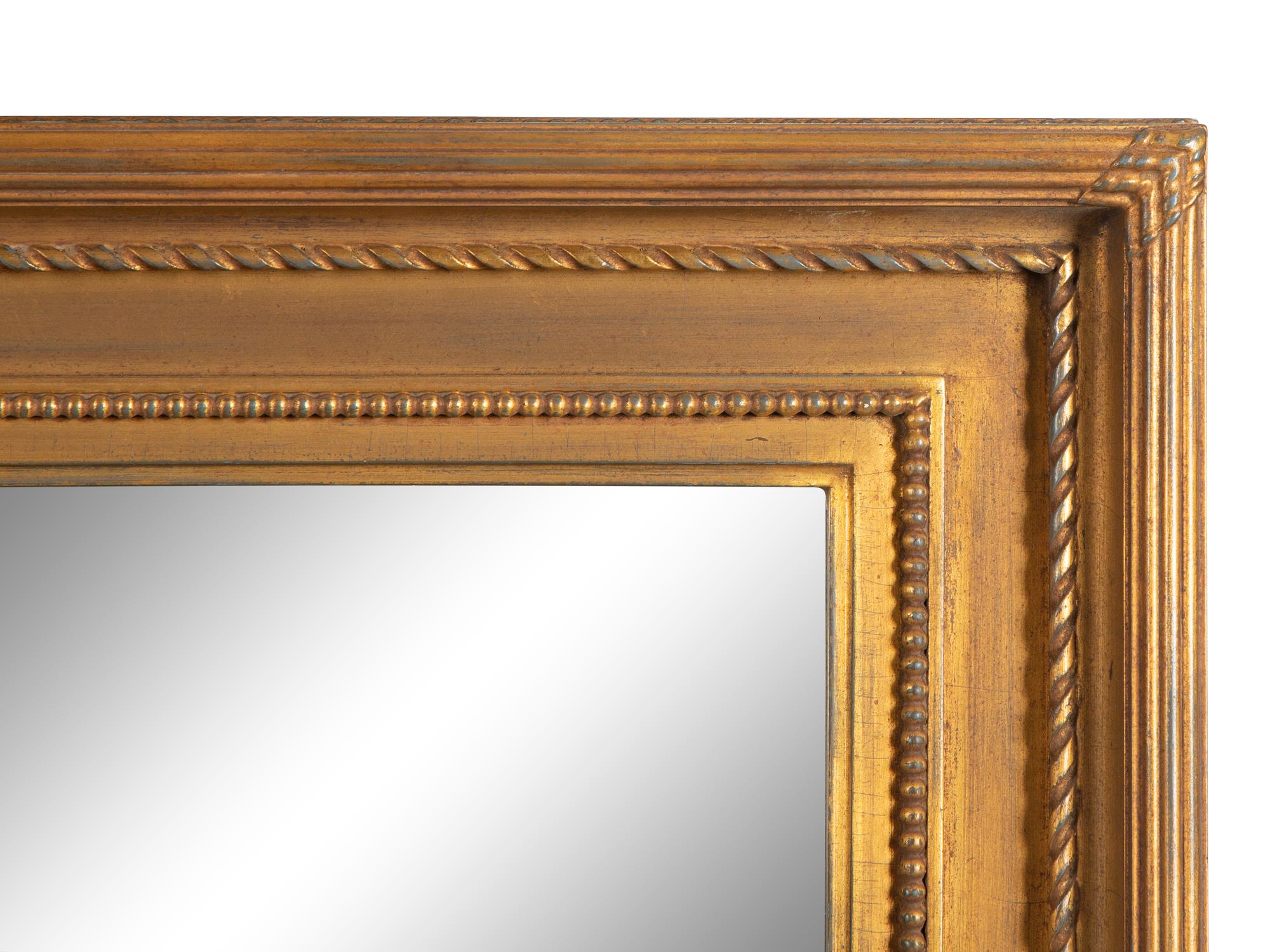 A Giltwood Framed Mirror — 20th Century