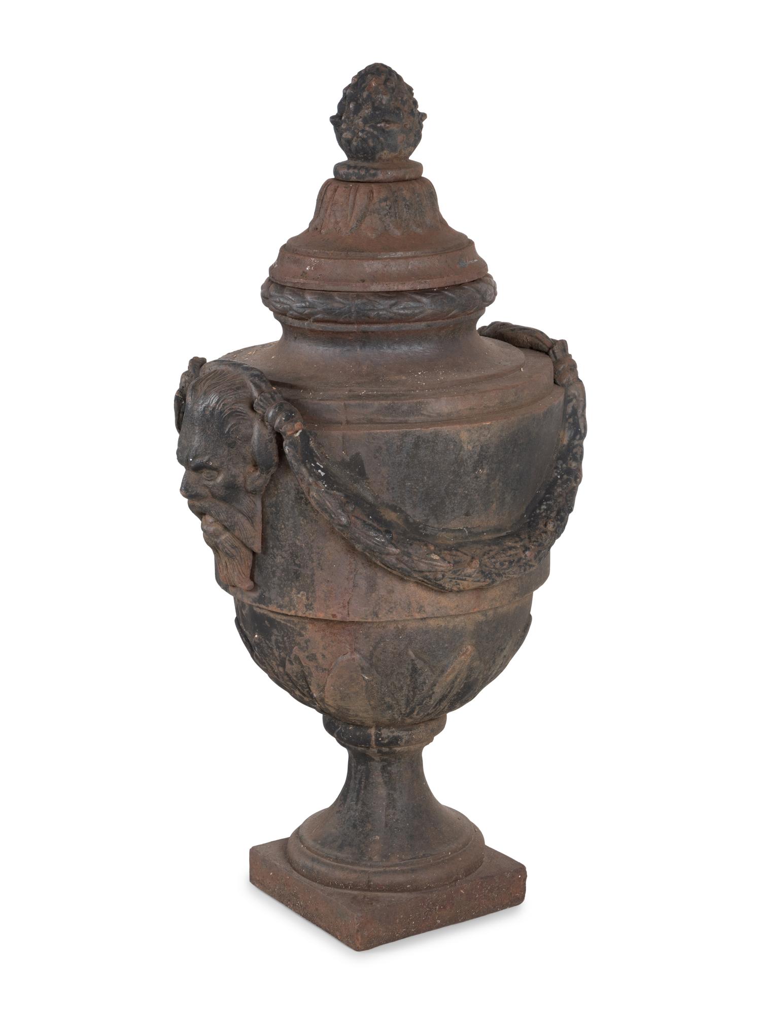 A Pair of Cast Iron Covered Garden Urns