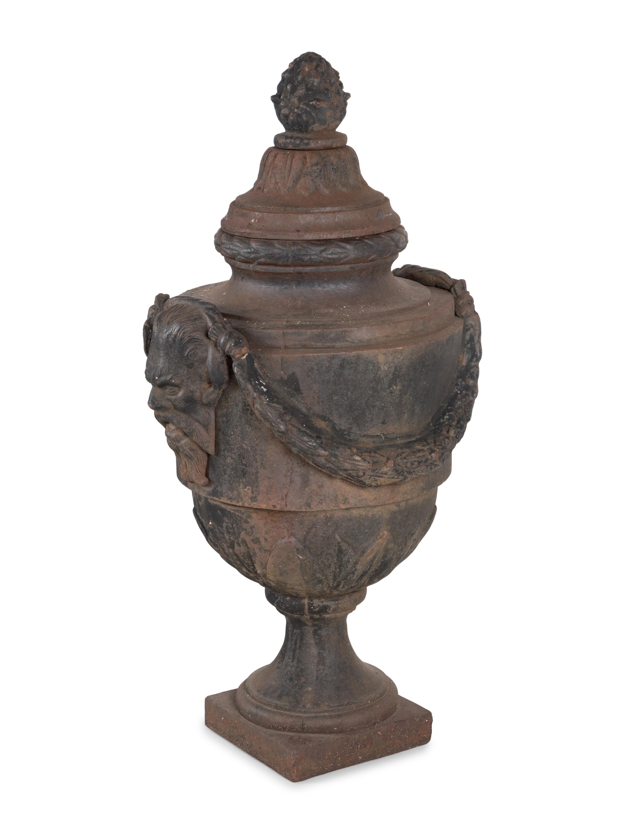 A Pair of Cast Iron Covered Garden Urns