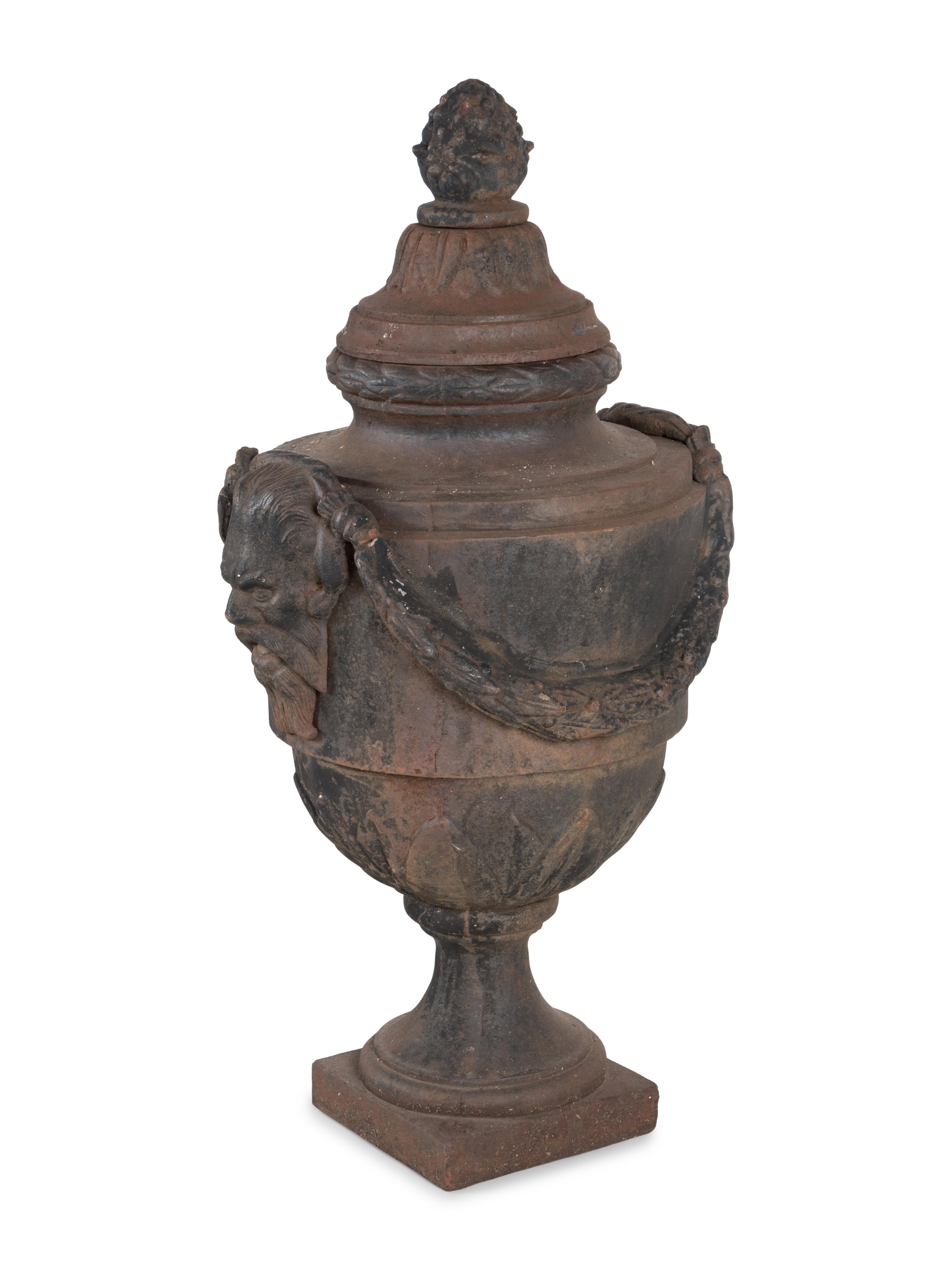 A Pair of Cast Iron Covered Garden Urns