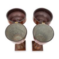 A Pair of George III Mahogany Urns