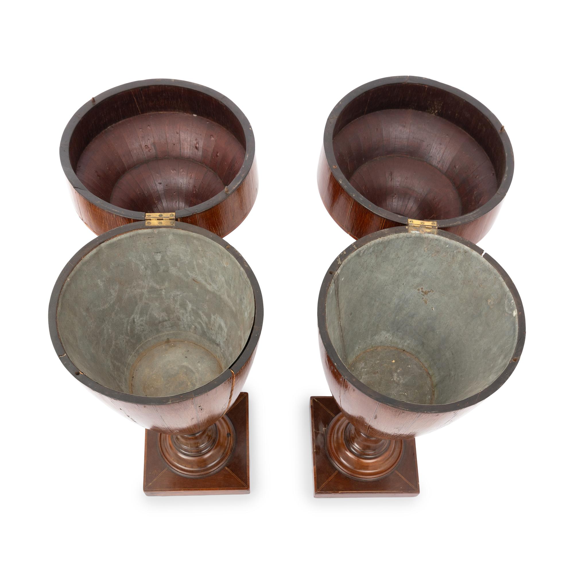 A Pair of George III Mahogany Urns