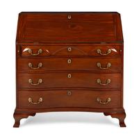 A Chippendale Walnut Serpentine Slant-Front Bureau