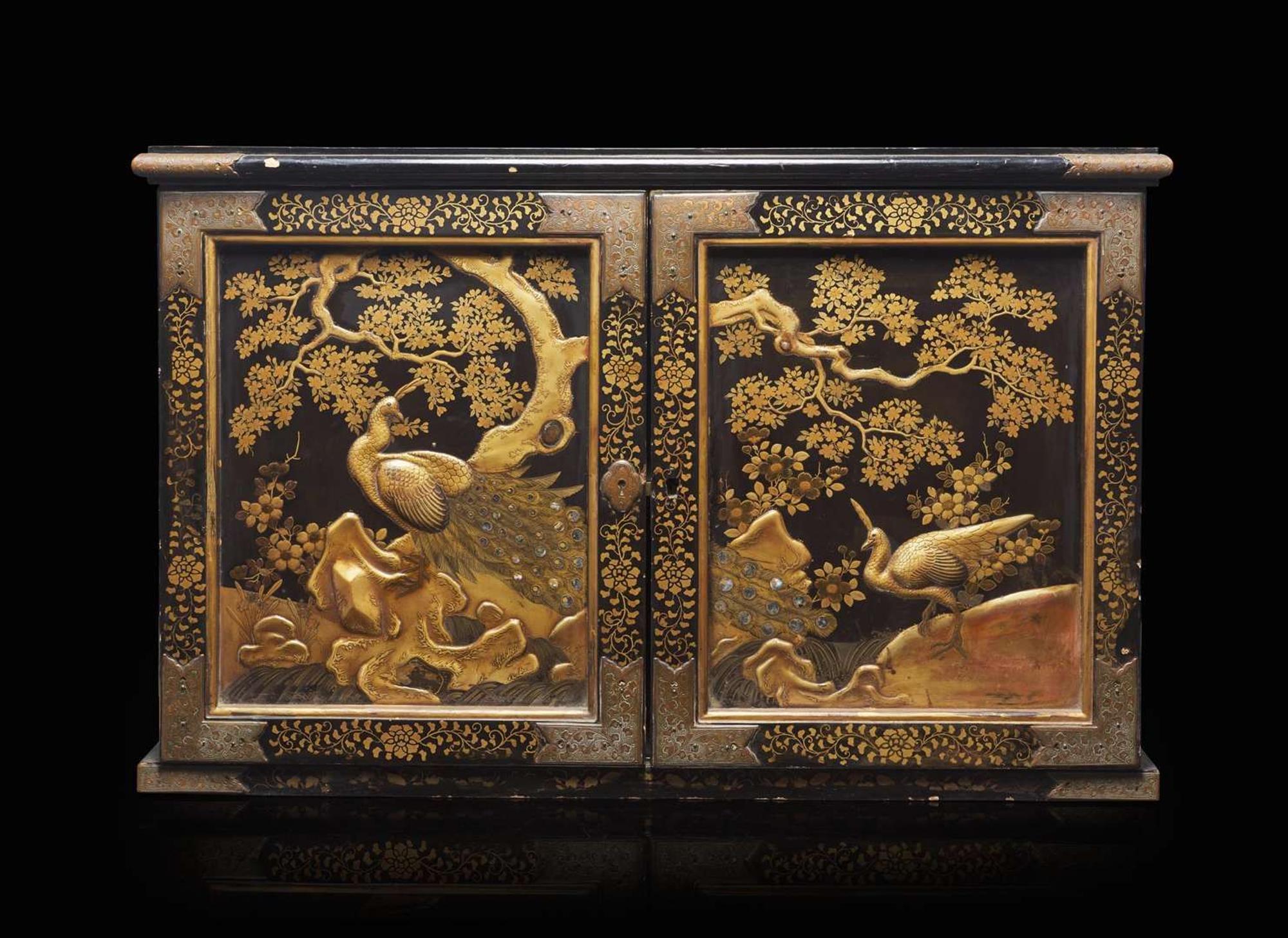 A Japanese black and gold lacquer two-door "Peacocks" cabinet, 18th/19th century 日本雙門漆箱 十八或十九世紀