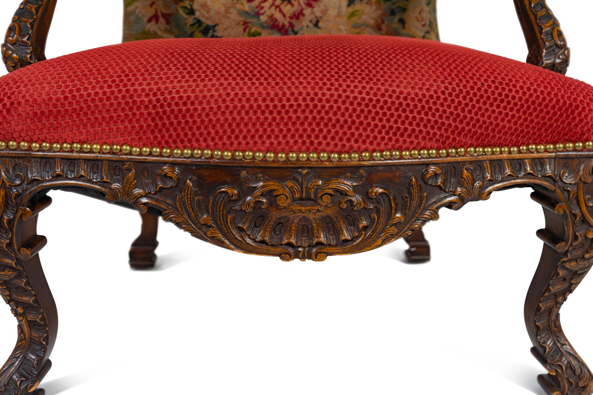 A Régence Style Carved Walnut Bergère à Oreilles with Petit Point Upholstery