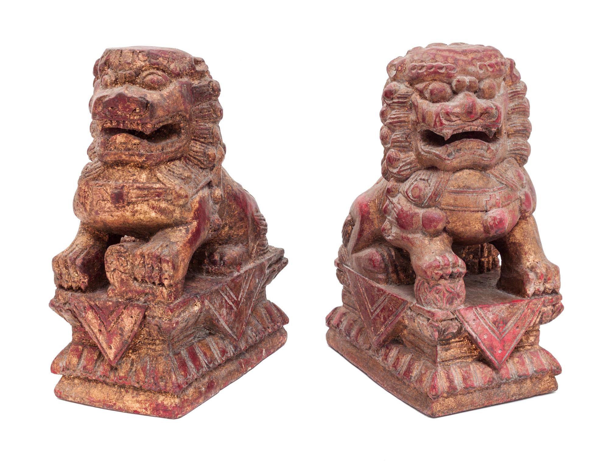 A Pair of Chinese Red and Gold Painted Carved Wood Foo Lions Height 10 1/4 inches. — 19TH CENTURY