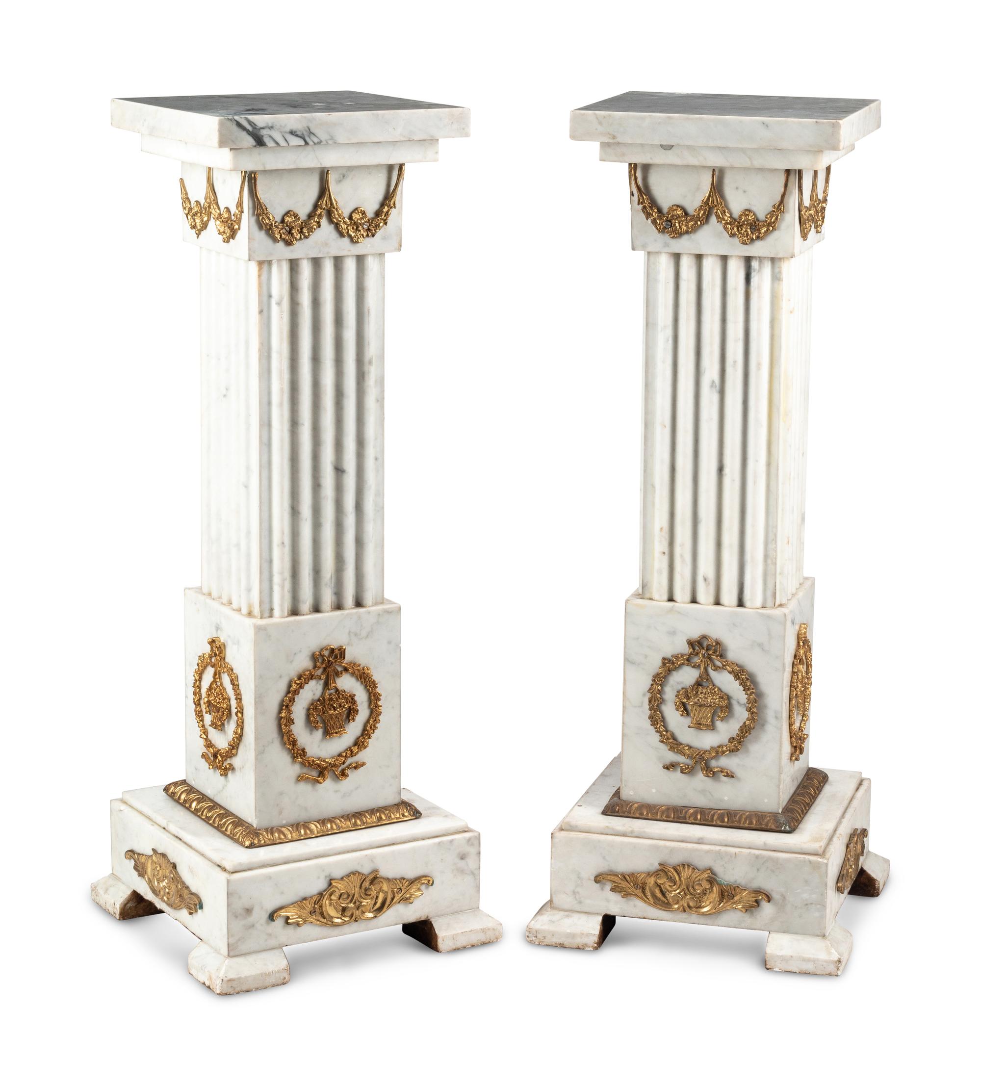 A Pair of Louis XVI Style Gilt Bronze Mounted White Marble Pedestals