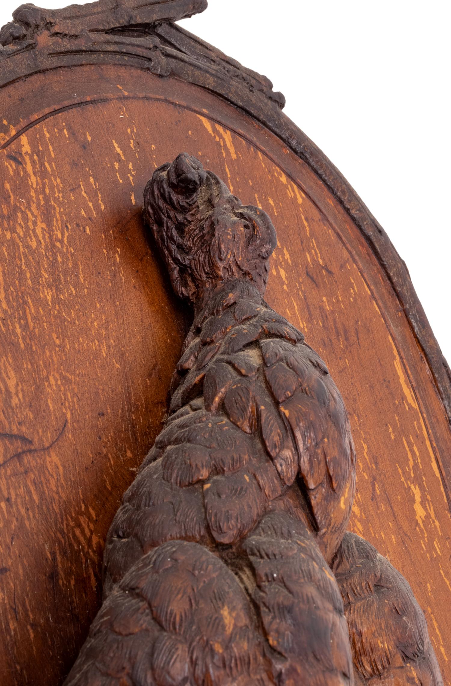 A Black Forest Carved Game Plaque