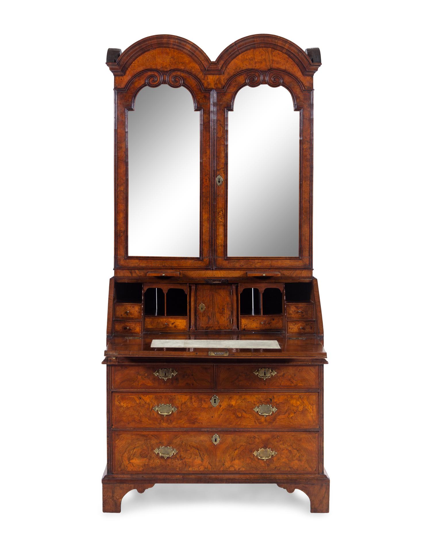 A George I Carved Burl Walnut Double-Dome Bureau Bookcase