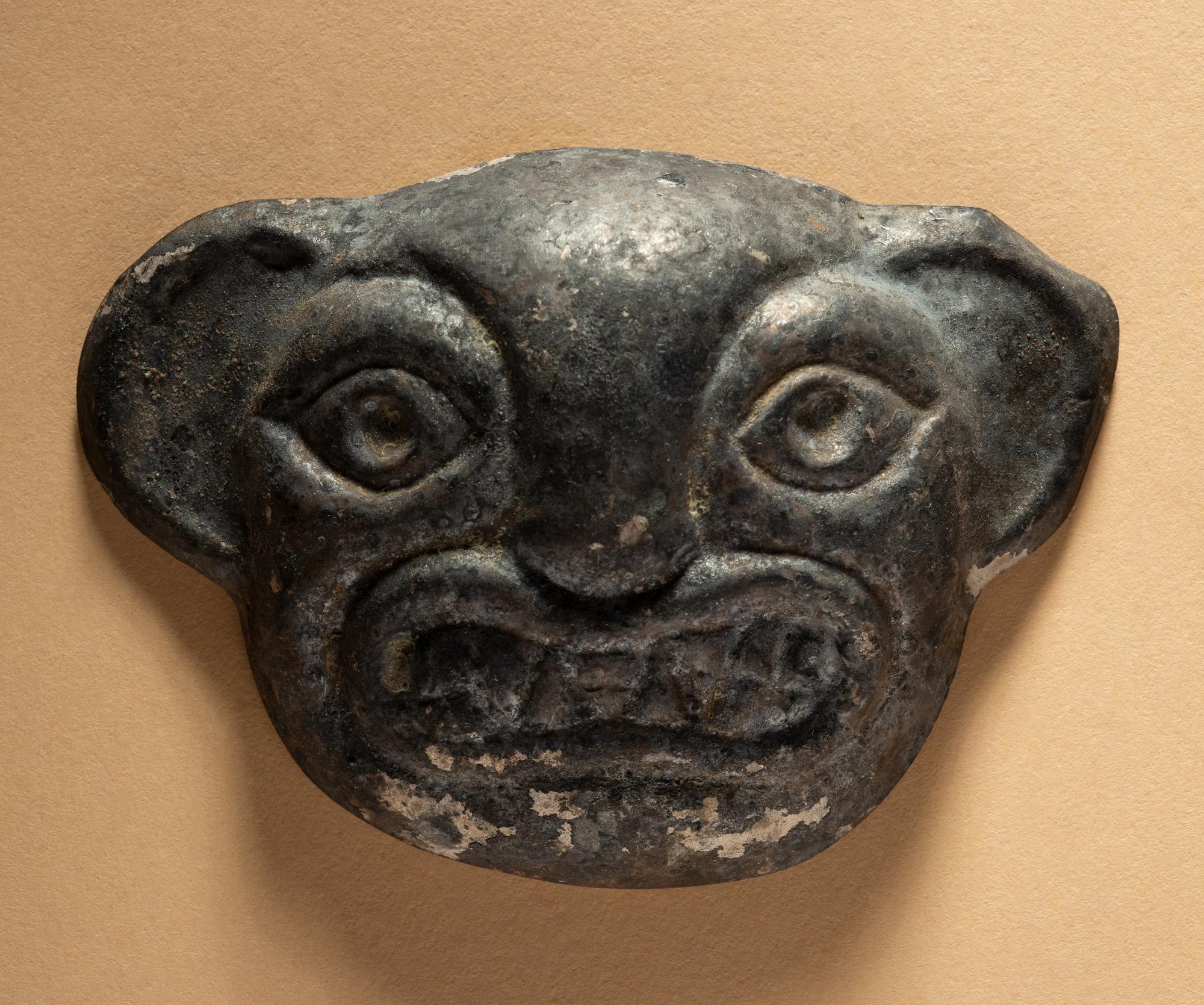 Two Moche Copper Masks