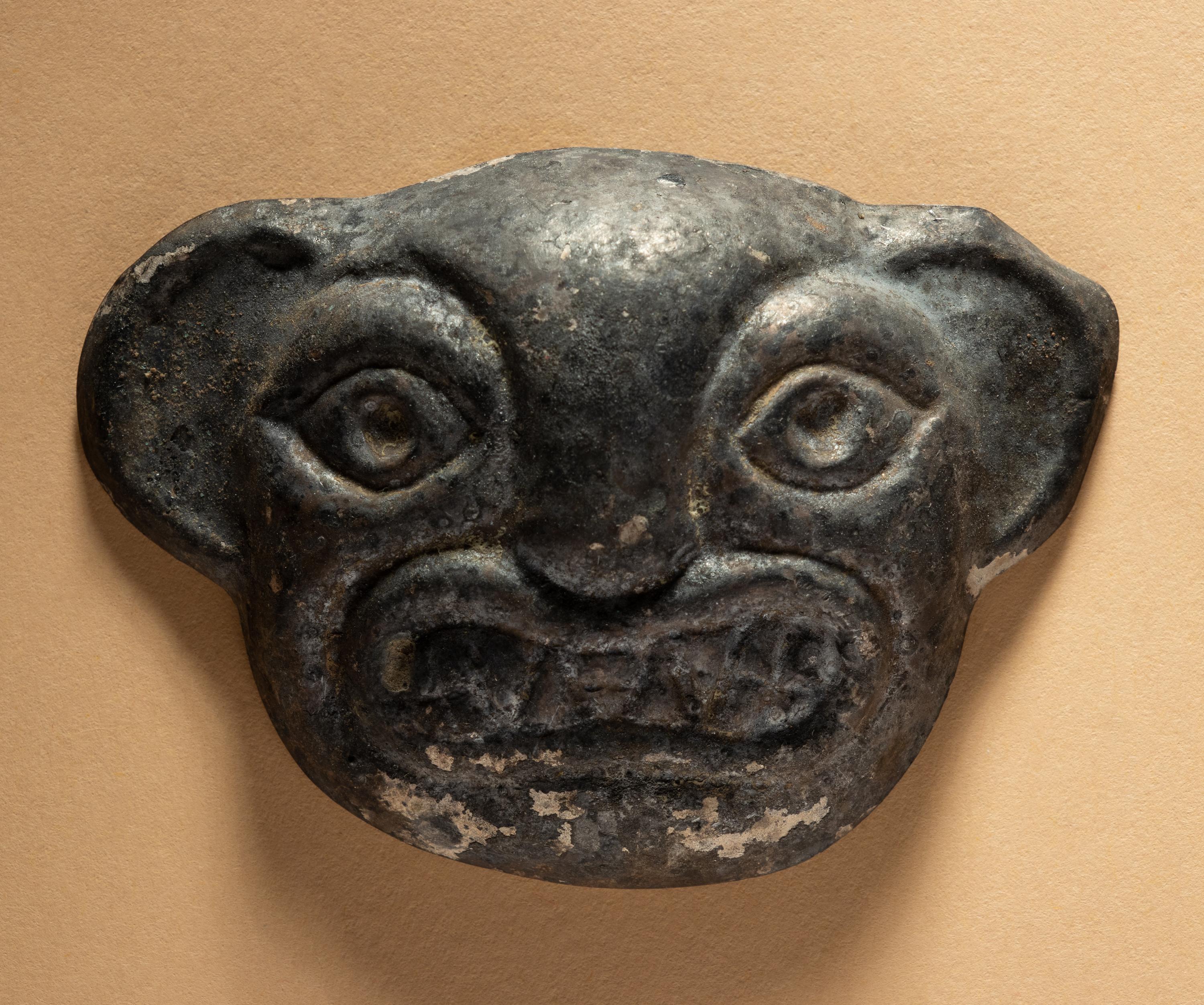Two Moche Copper Masks