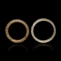 Two Chinese Carved Precious Stone Bangles, Qing Dynasty or Earlier 清或以前 青玉、瑪瑙雕螭龍紋鐲各一