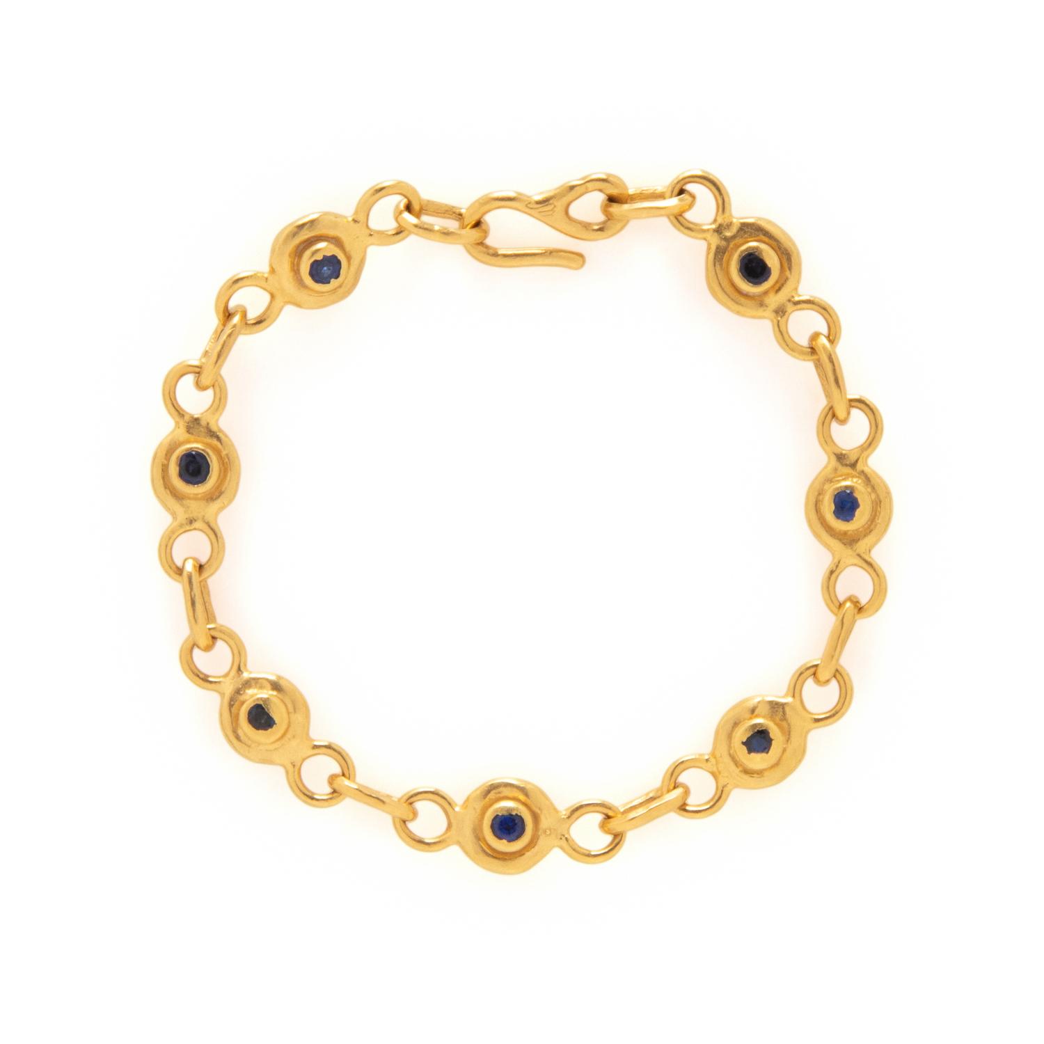JEAN MAHIE, DIAMOND, SAPPHIRE, AND HIGH KARAT GOLD BRACELET