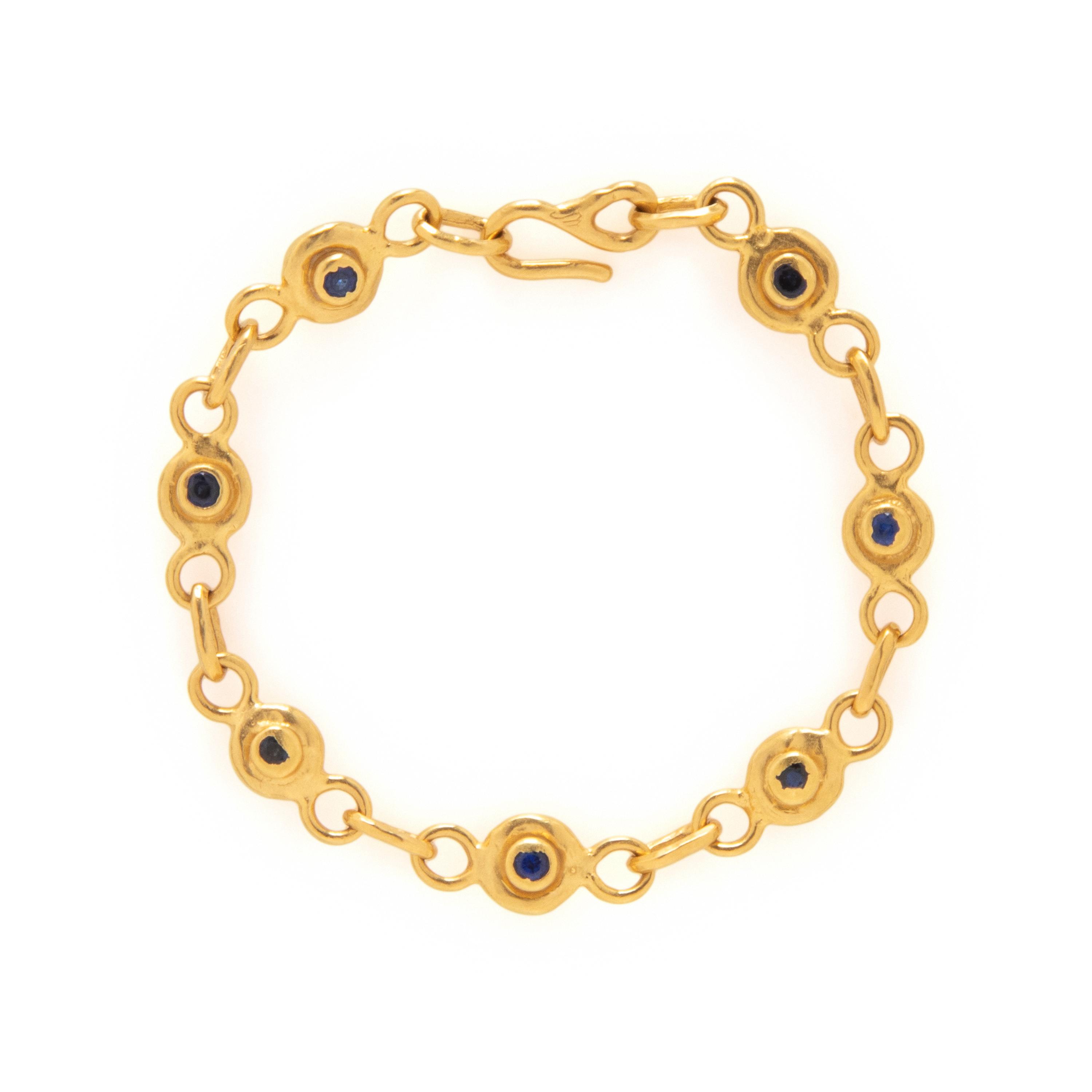 JEAN MAHIE, DIAMOND, SAPPHIRE, AND HIGH KARAT GOLD BRACELET