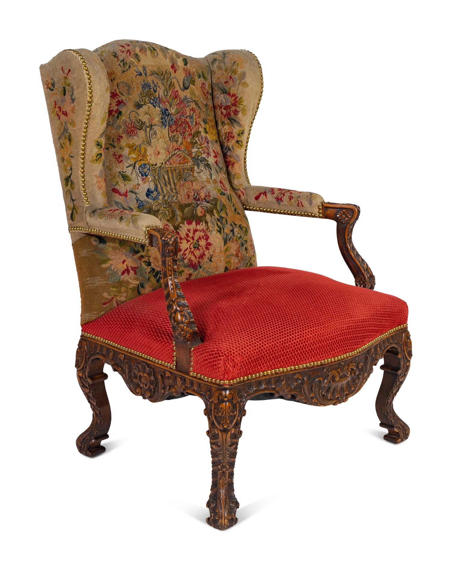 A Régence Style Carved Walnut Bergère à Oreilles with Petit Point Upholstery