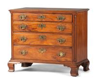 A Chippendale Carved and Figured Mahogany Chest of Drawers