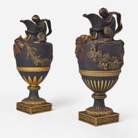 A Near Pair of Wedgwood Gilt and Bronzed Black Basalt Water and Wine Ewers UK, late 19th century