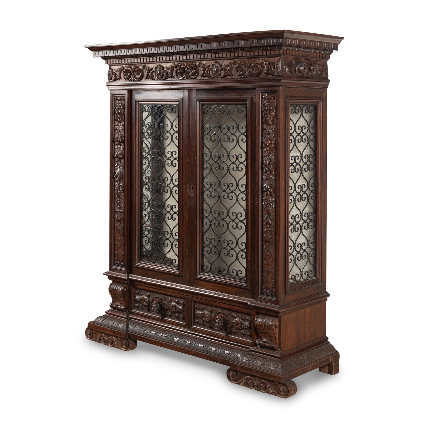 An Italian Renaissance Style Walnut and Wrought Iron Bookcase