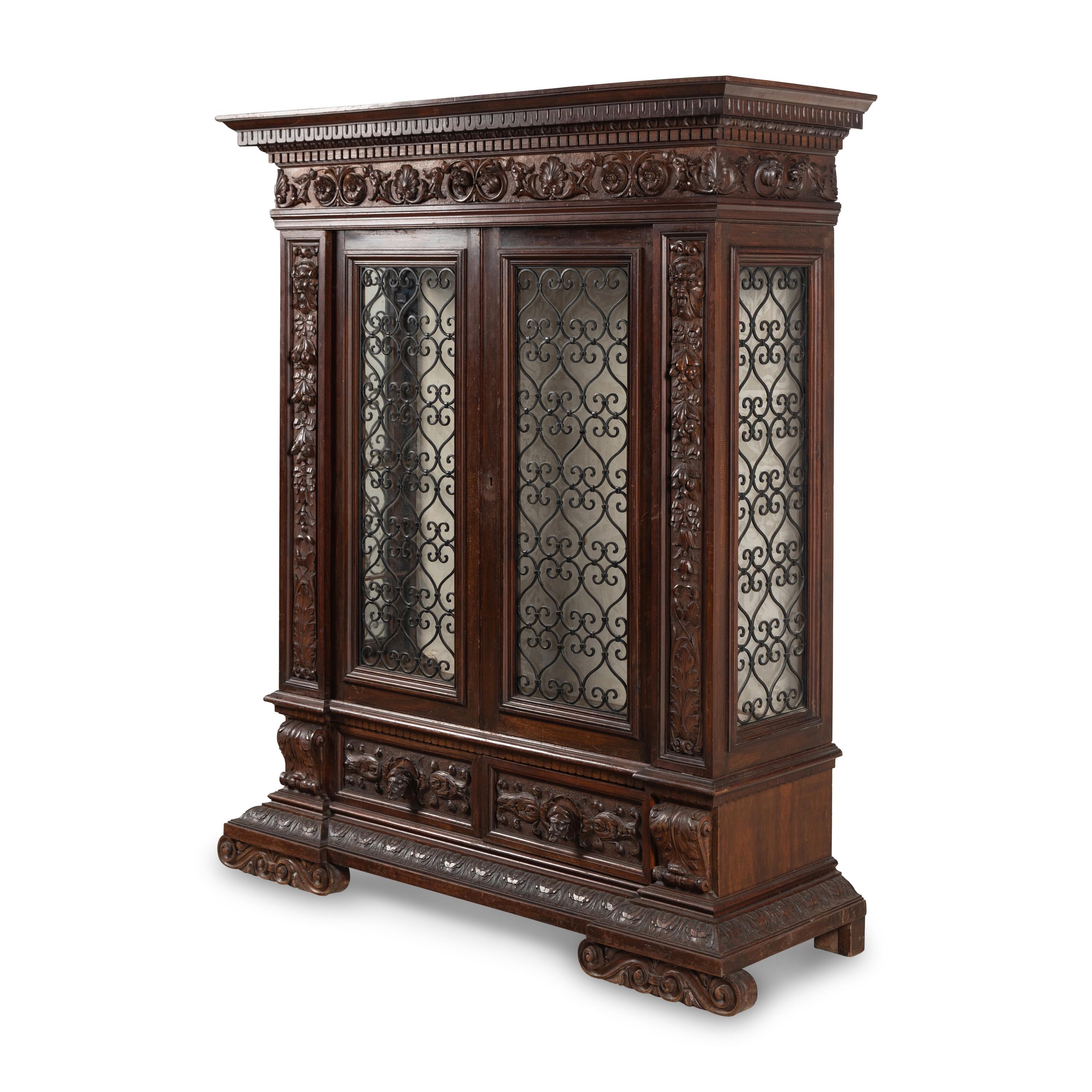 An Italian Renaissance Style Walnut and Wrought Iron Bookcase