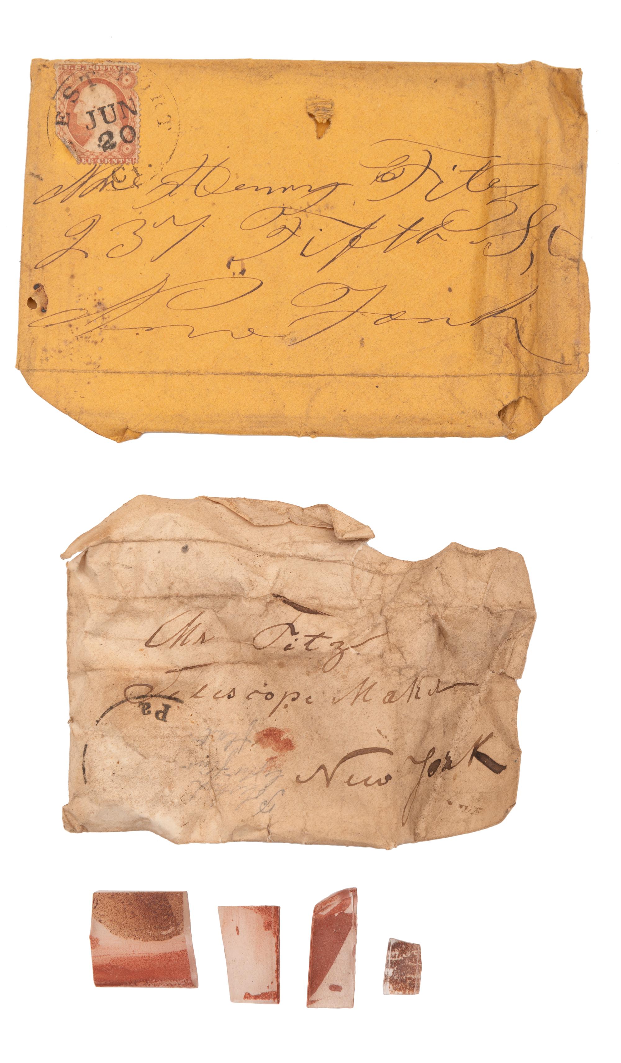 A collection of lenses and glass samples with manuscript notes addressed to Henry Fitz, New York, found in the workshop of George W. Fitz, Peconic, New York.