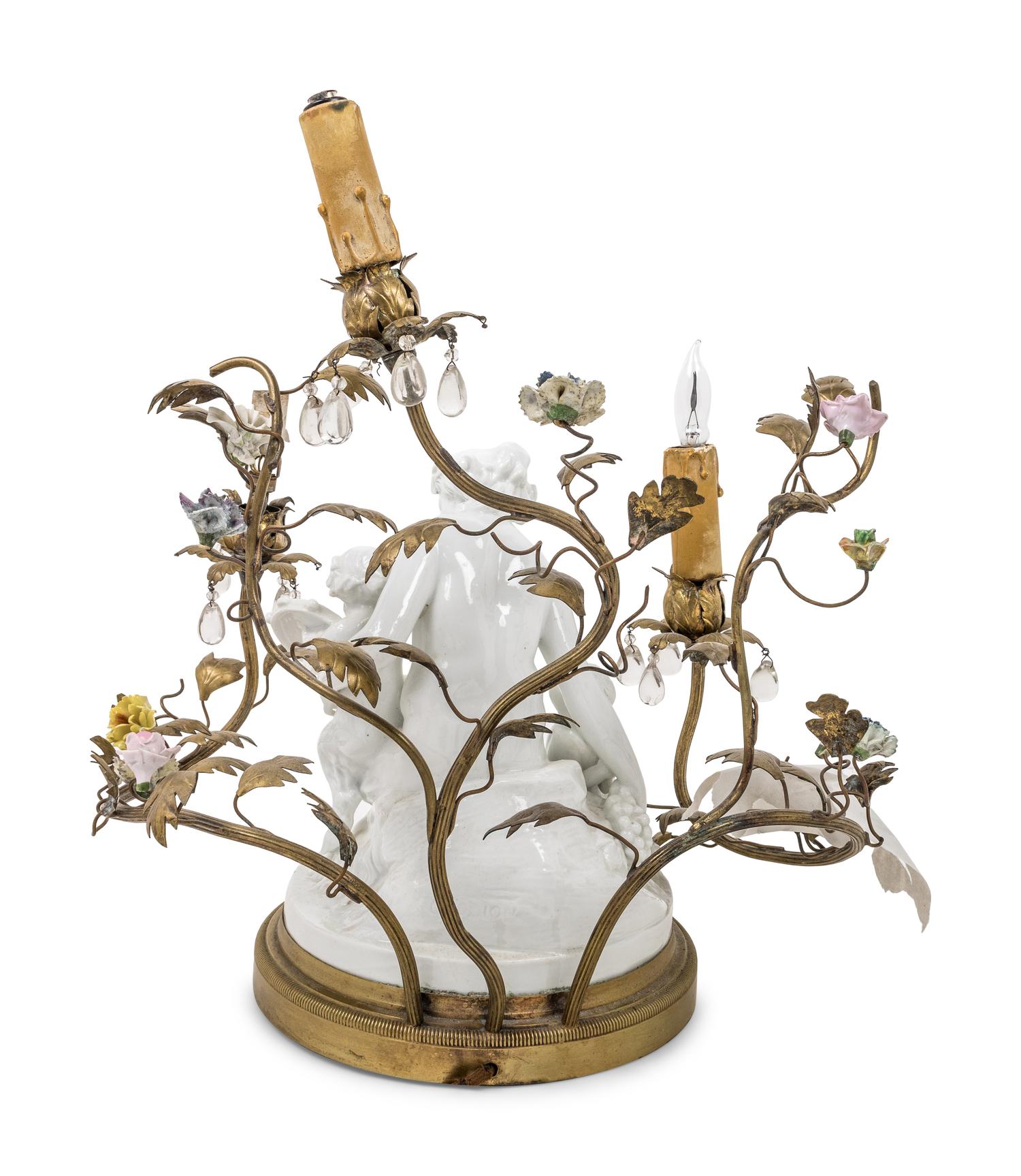 A Gilt Metal Mounted White Glazed Porcelain Figural Group after Clodion Mounted as a Lamp