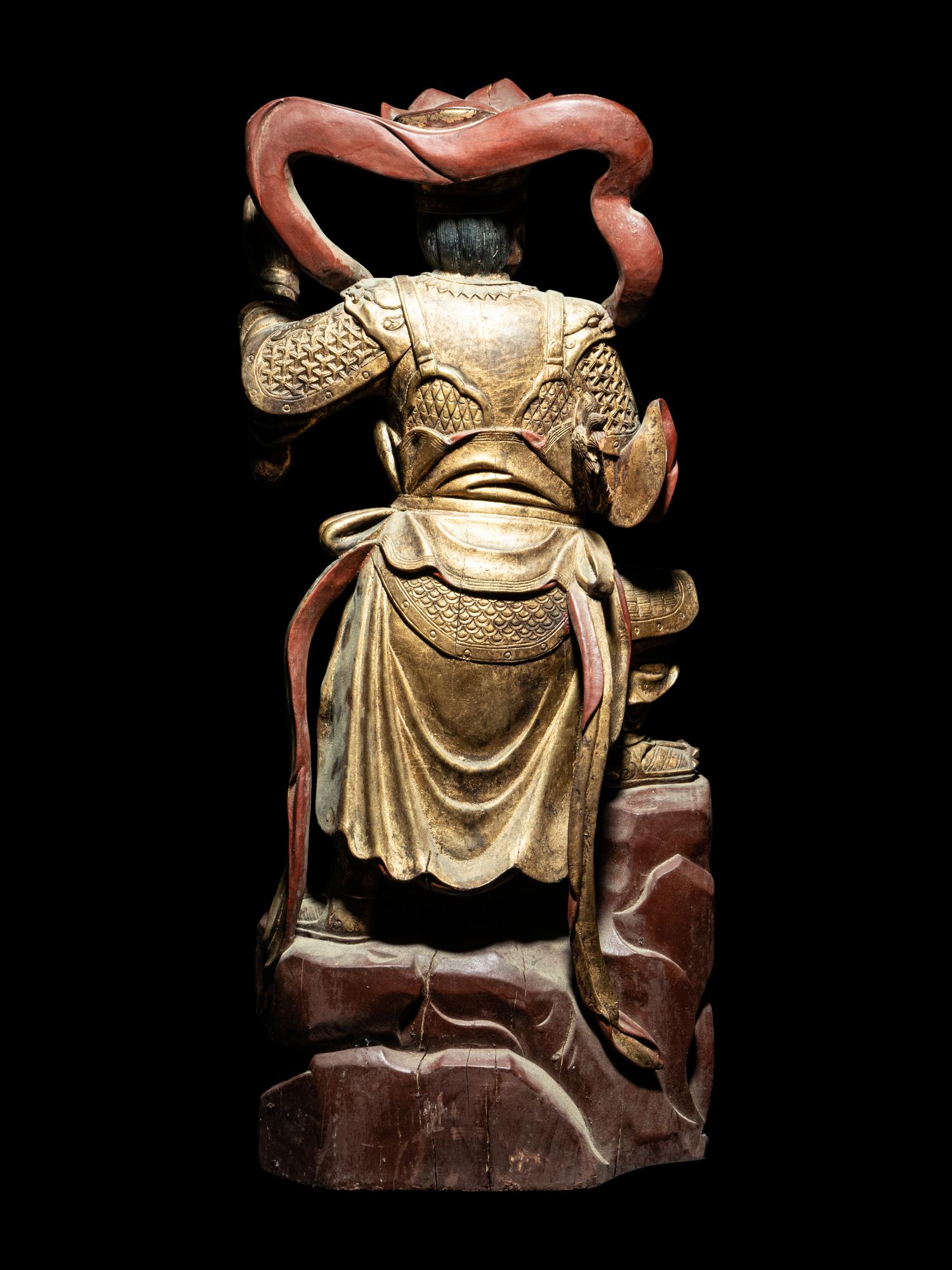 A Set of Four Gilt and Red Lacquered Wood Figures of Guardians