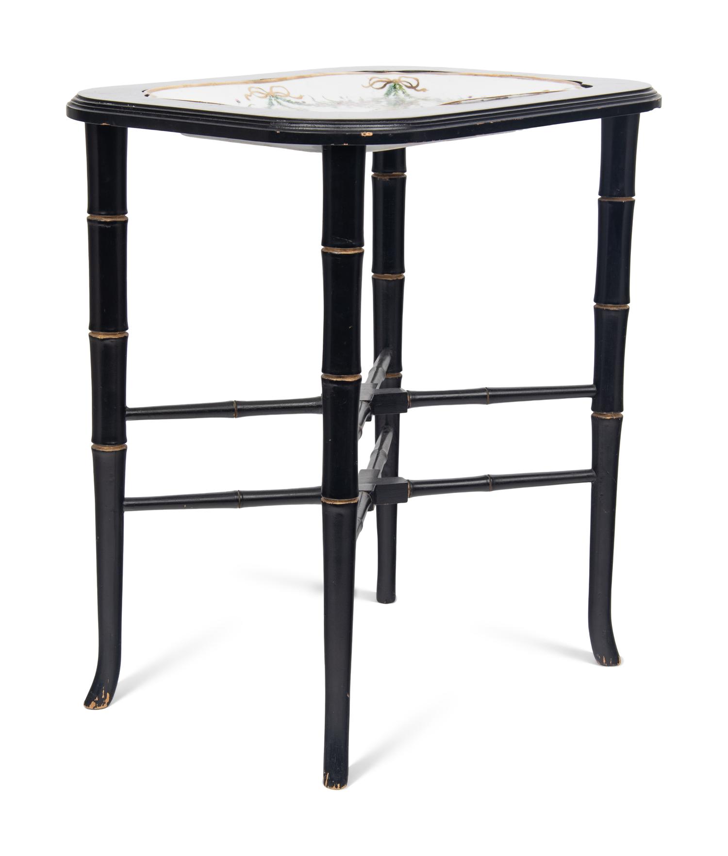 A German Porcelain Tray Set in a Later Ebonized Side Table