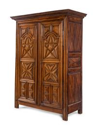 A Louis XIII Style Carved Walnut Armoire