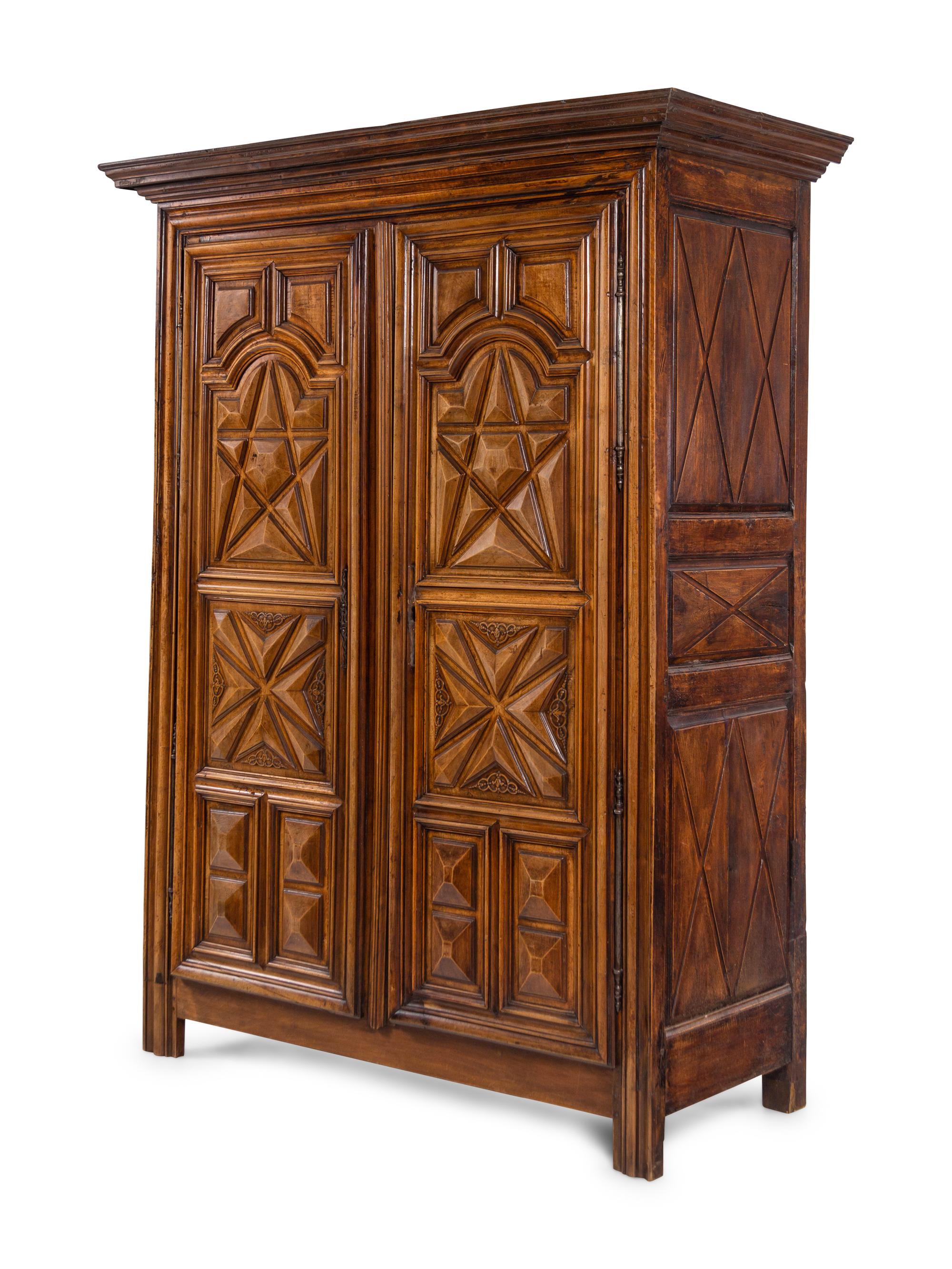 A Louis XIII Style Carved Walnut Armoire