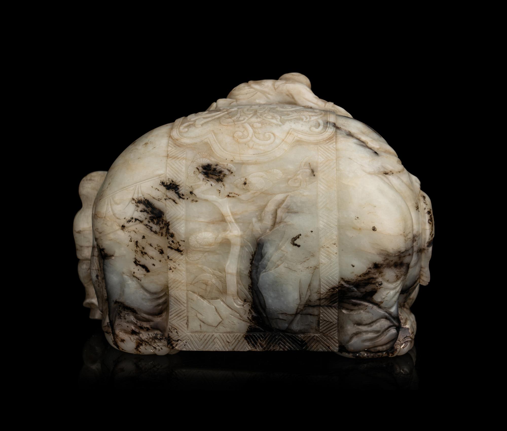 A Carved Jade ‘Elephant and Children’ Figural Group