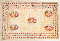 A Wool Area Rug 4 feet 8 3/4 inches x 4 feet 4 1/2 inches.