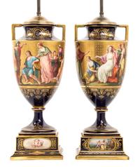 A Pair of Royal Vienna Porcelain Urns on Stands, Height of vase 18 1/4 inches.