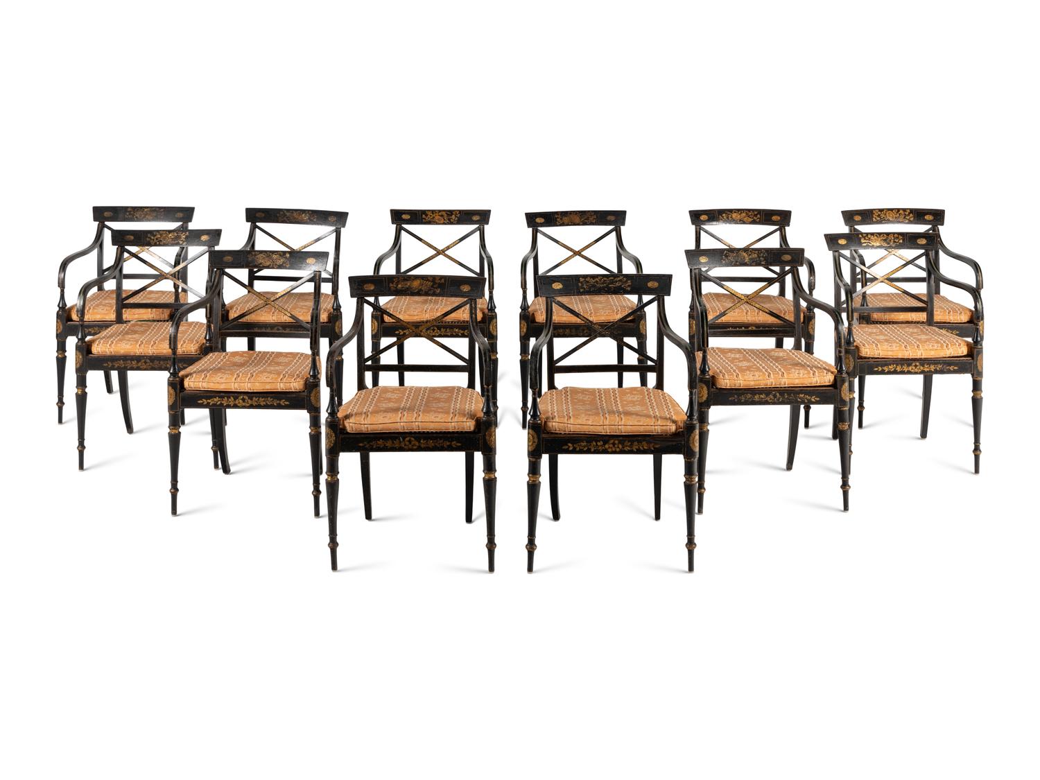 A Set of Twelve Regency Ebonized and Parcel Gilt Dining Chairs