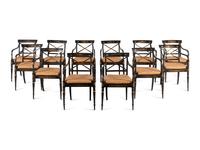 A Set of Twelve Regency Ebonized and Parcel Gilt Dining Chairs