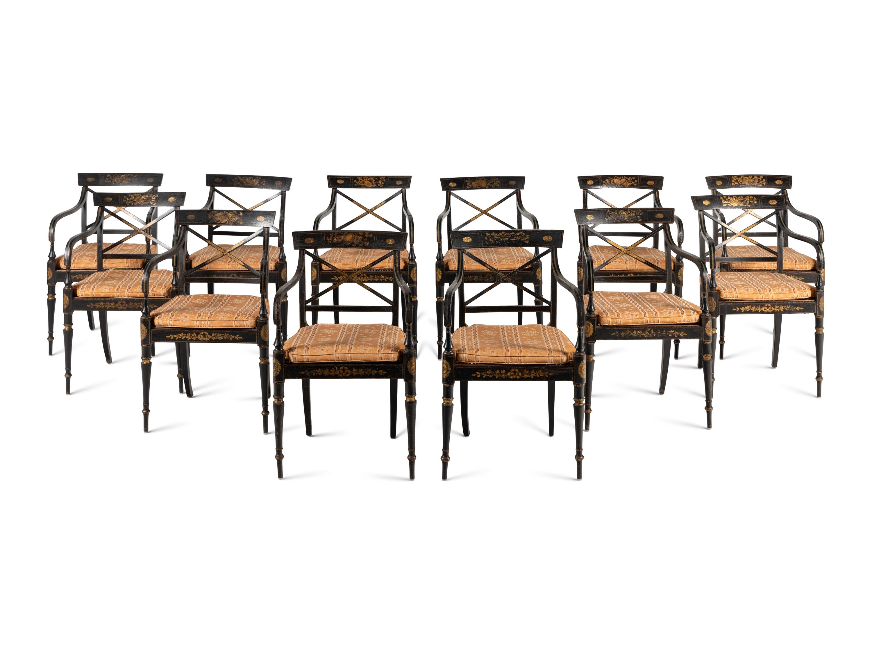 A Set of Twelve Regency Ebonized and Parcel Gilt Dining Chairs