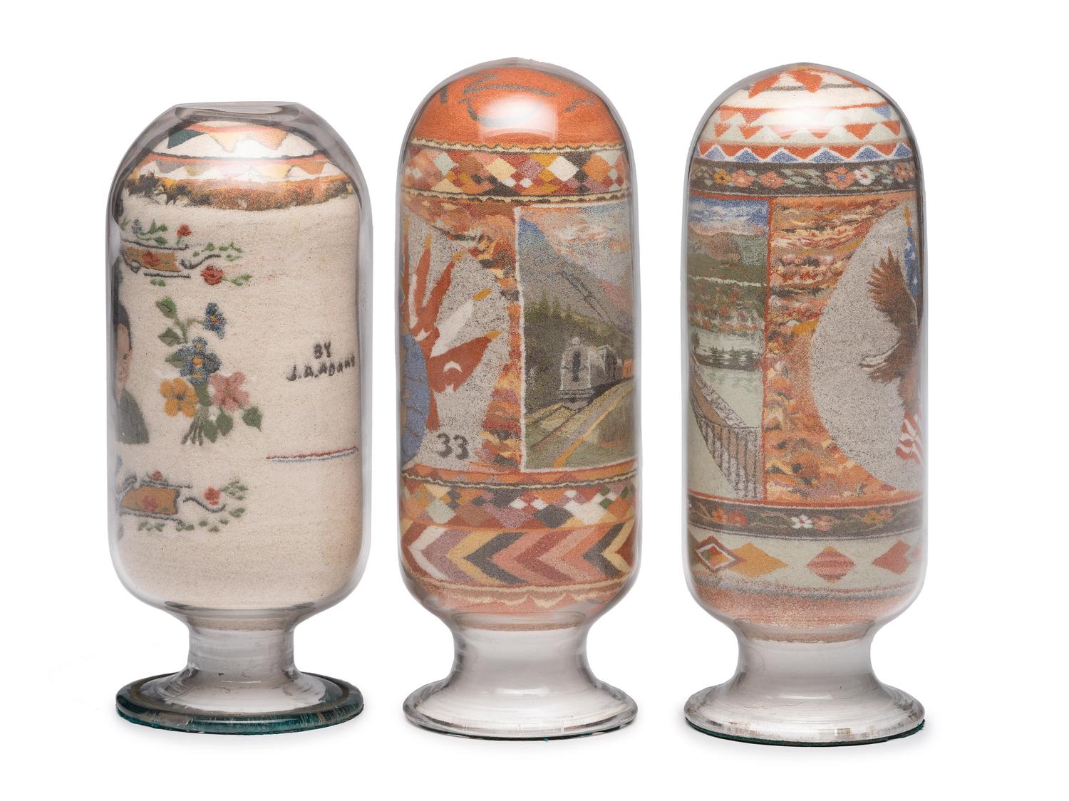 A Collection of John A. Adams Sand Art Bottles, Along with Custom Box and Unused Bottle