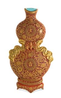 A Gilt Decorated Coral Ground Porcelain Gourd-Form Wall Vase Height 11 1/4 inches.