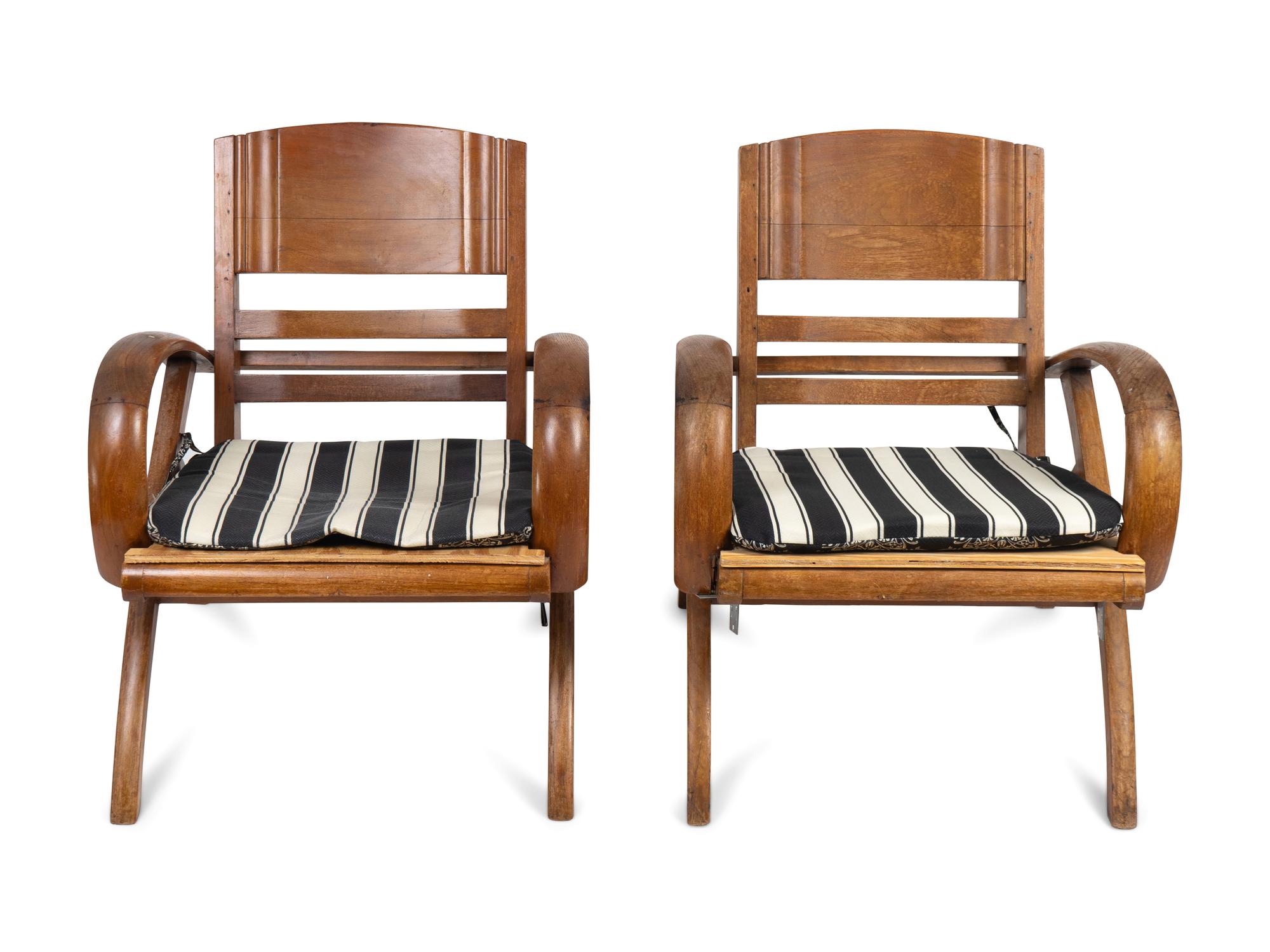 A Pair of British Colonial Teak Open Armchairs — FIRST QUARTER 20TH CENTURY