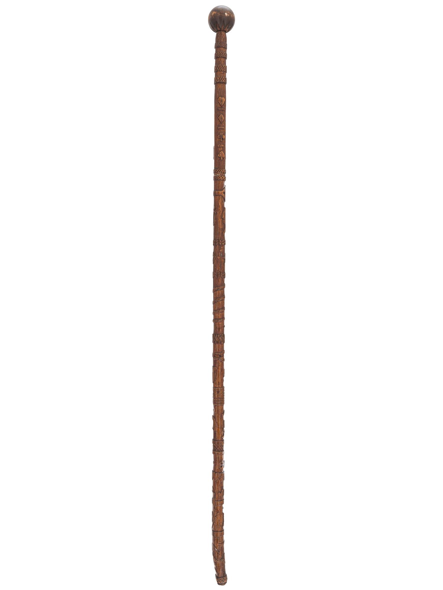 [CIVIL WAR]. GAR folk art carved cane featuring corps badges and patriotic motifs.