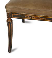 A Set of Four English Regency Style Ebonized and Parcel Gilt Mahogany Dining Chairs