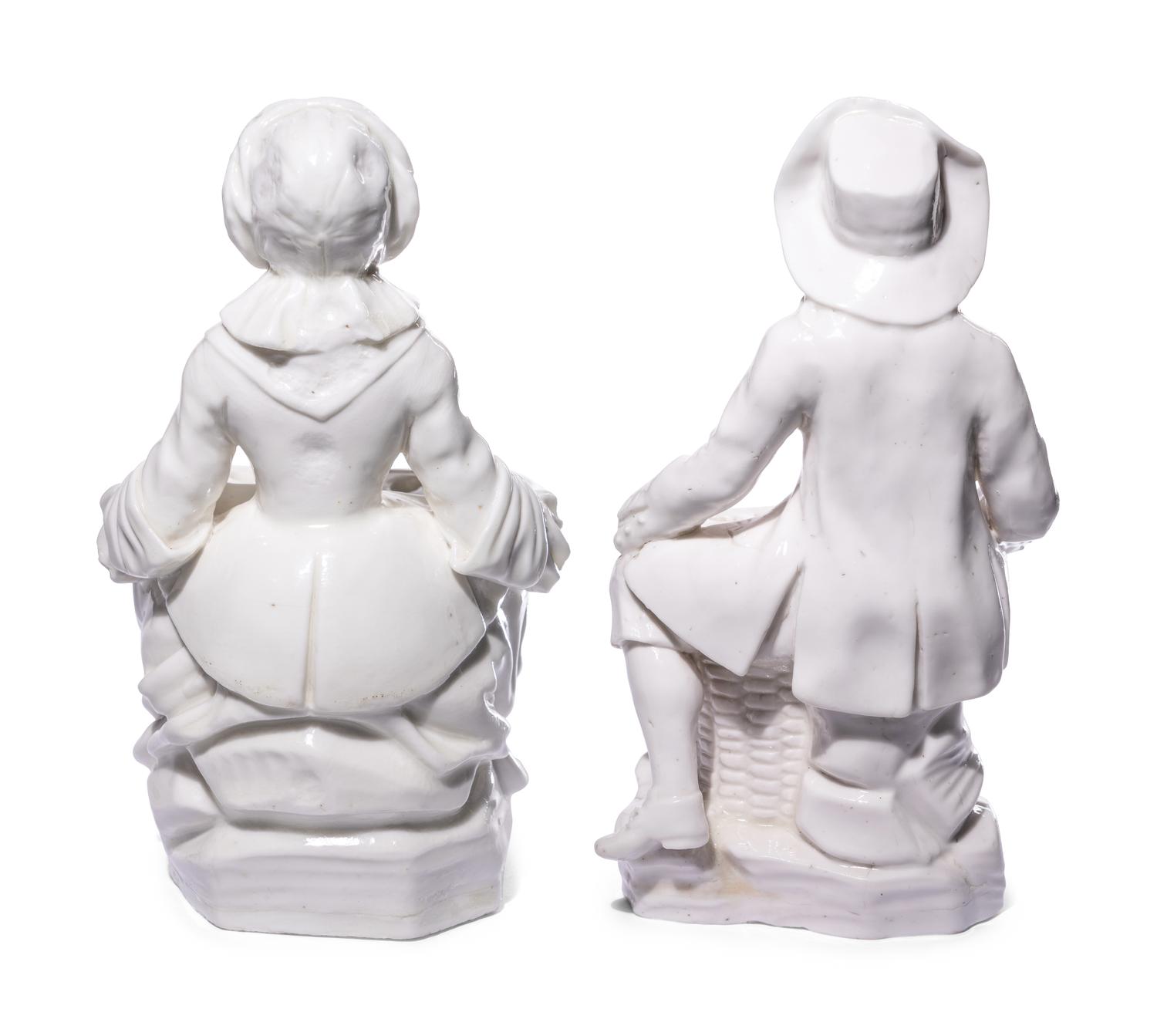 A Pair of French Soft-Paste Porcelain White Bouquetière Figures