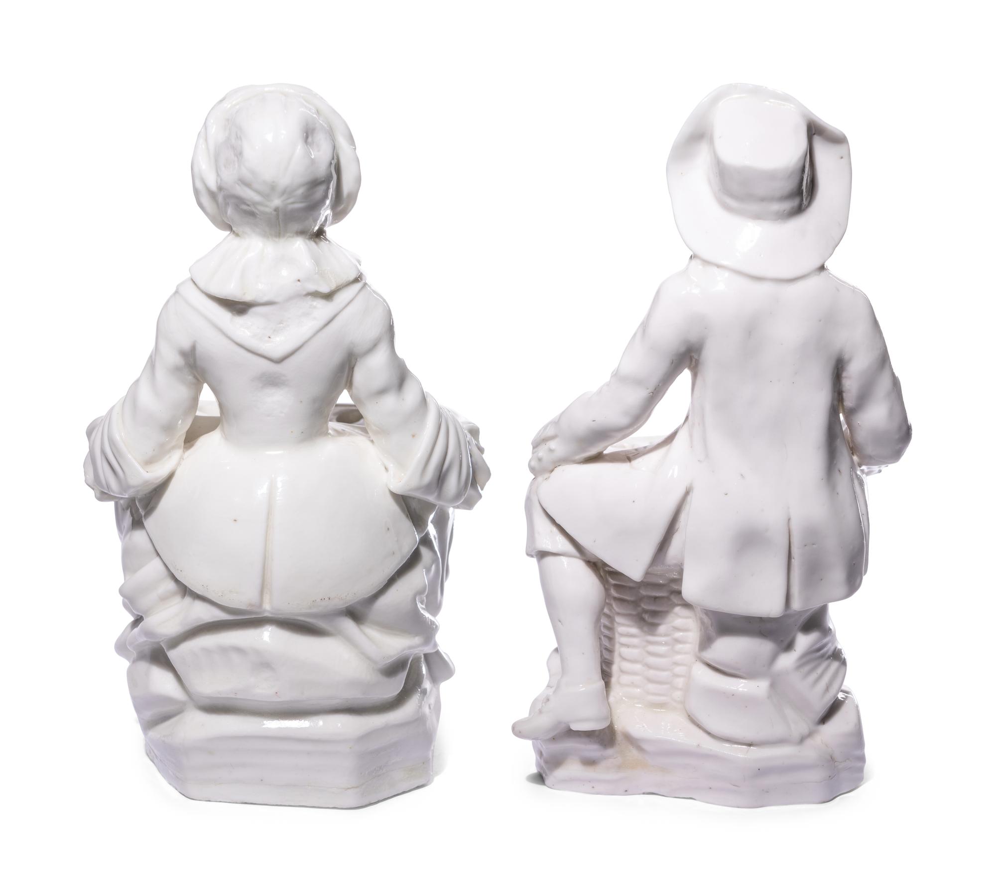 A Pair of French Soft-Paste Porcelain White Bouquetière Figures