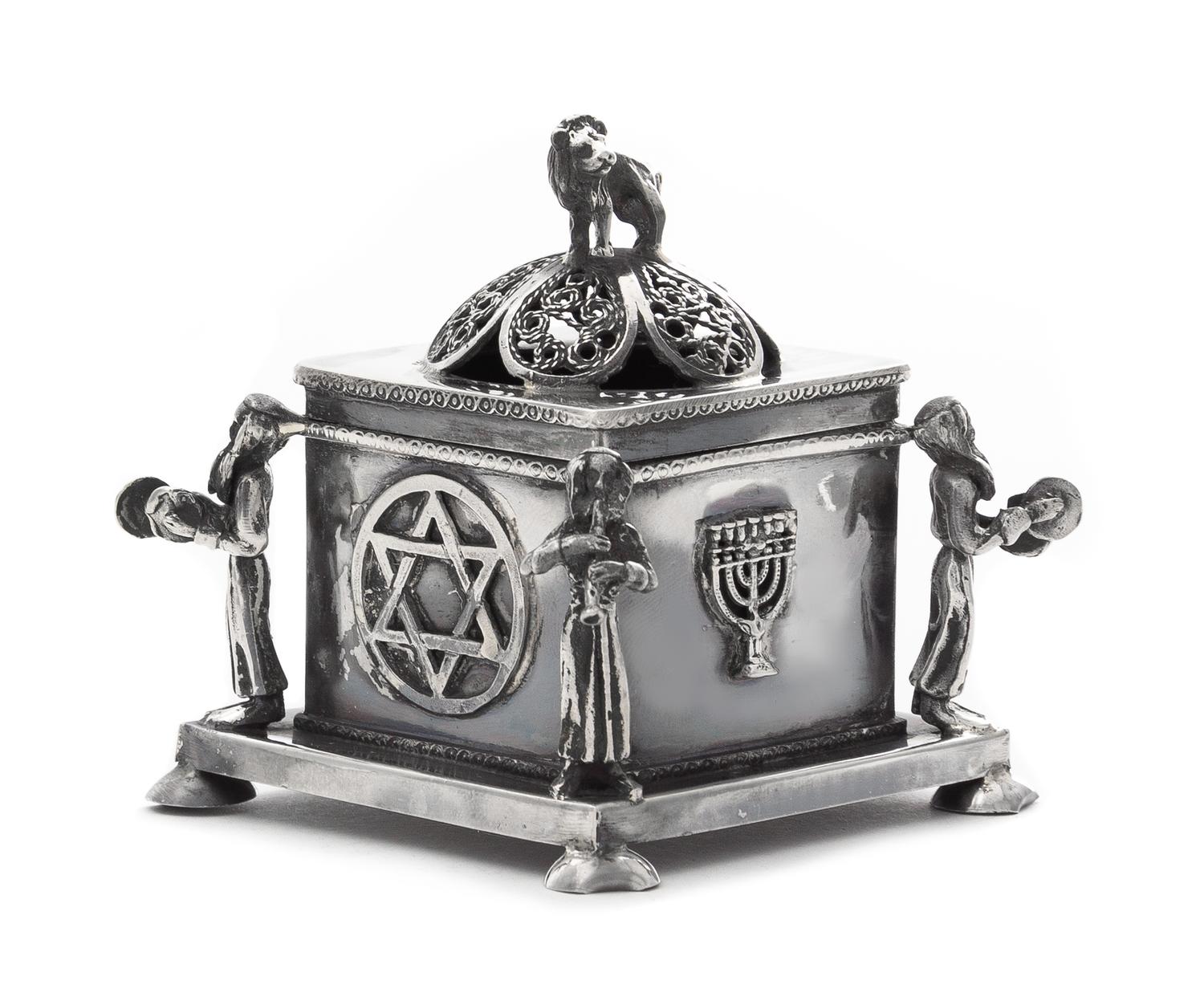 A Russian Silver Spice Box, Maker's Mark Obscured, Assay Mark O.C., Minsk, 1874, the lion form finial above the domed filigree decorate