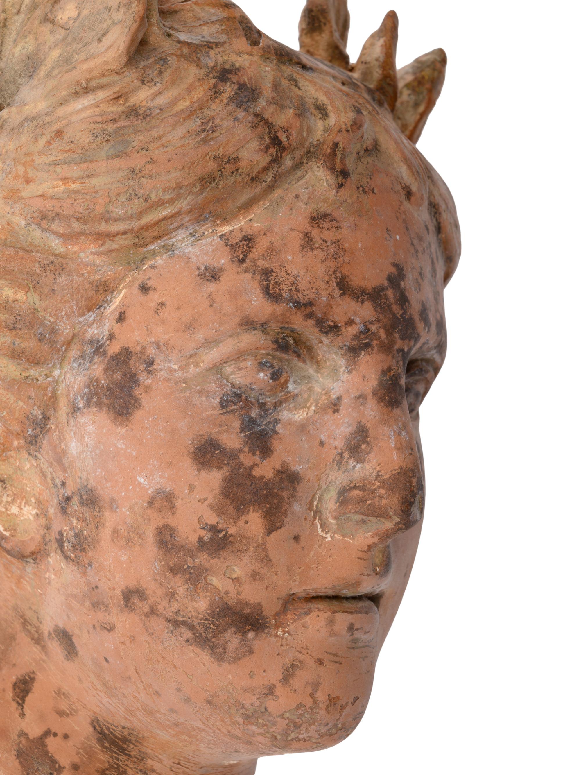 A Roman Style Terracotta Head of a Woman