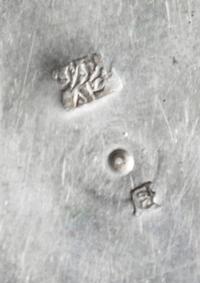 A Chinese Silver Box, , of circular form, the lid decorated with exotic bords and a repeating floral border.