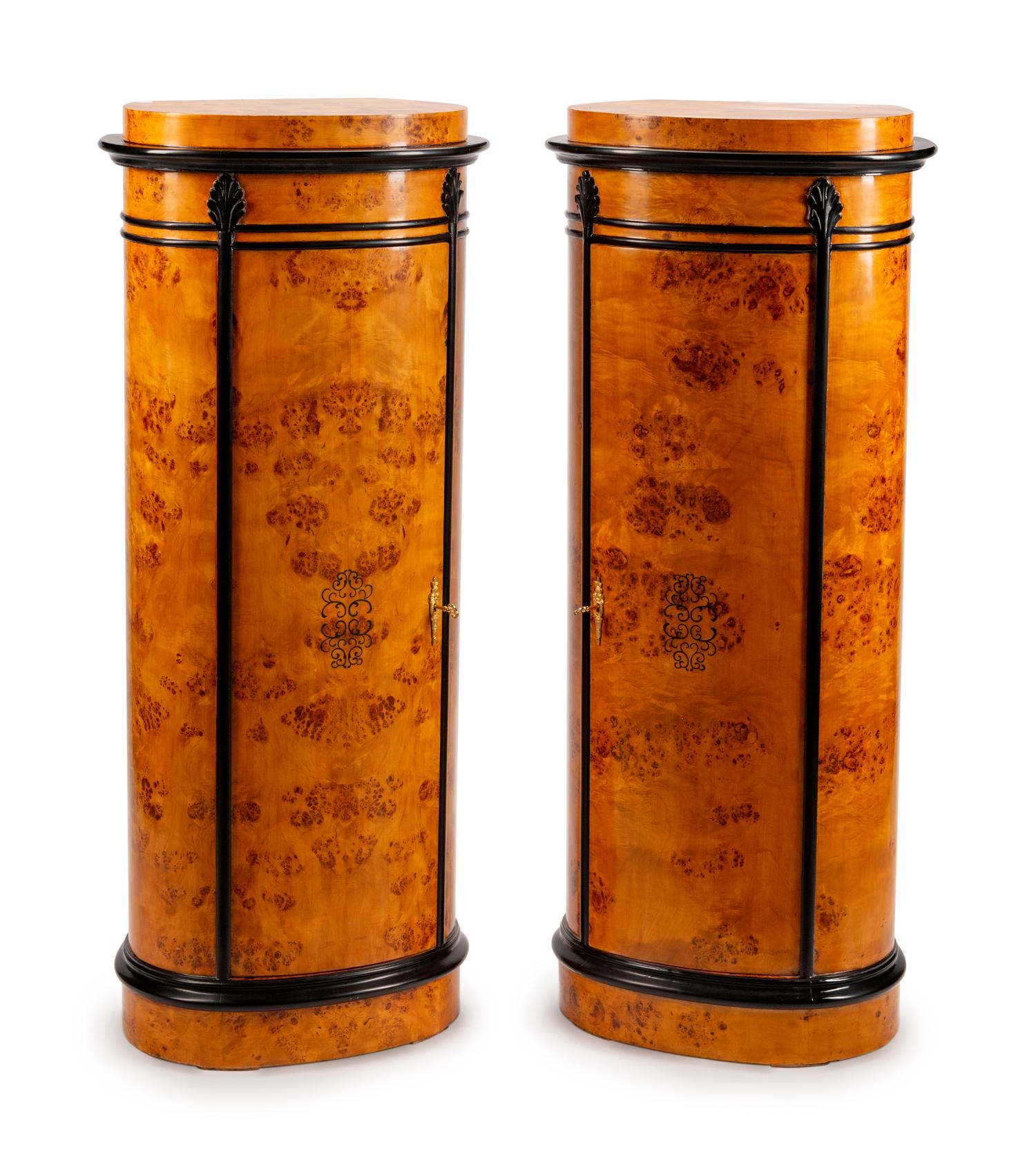 A Pair of Danish Oval Pedestal Cabinets