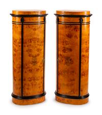 A Pair of Danish Oval Pedestal Cabinets